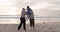 Grandparents, child and family hug at beach for fun vacation, holiday or adventure at sunset. Senior man, woman and a