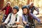 Grandparents With Children Cycling Through Fall Woodland