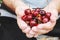 Grandparents feed the child with cherries.selective focus