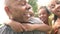 Grandparents Giving Grandchildren Piggyback Ride In Garden