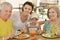 Grandparents with grandchild at breakfast