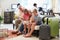 Grandparents With Grandchildren Arriving In Hotel Lobby