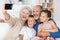 Grandparents and grandchildren with a camera