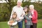 Grandparents With Grandchildren Holding Football