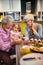 Grandparents with granddaughter in kithcen