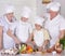 Grandparents with grandsons cooking together