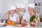 Grandparents with grandsons cooking together