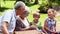 Grandparents having a picnic with their grandchildren