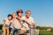 Grandparents helping children ride bicycle