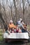 Grandparents and kids riding on four wheeler with trailer