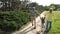 Grandparents lifting up toddler boy outdoor