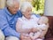 Grandparents outdoors on patio with baby