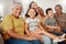 Grandparents, parents and children being happy, smile or laugh on sofa in living room for bonding, embrace or for loving