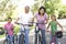 Grandparents In Park With Grandchildren