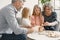 Grandparents play tower game with two girls