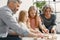 Grandparents play tower game with two girls