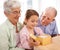 Grandparents will always spoil you. a senior couple giving a gift to their granddaughter.