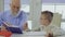 Grandson asks grandpa to help him with homework