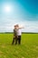 Grandson and grandfather in field