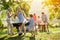 Grandson helps grandparents to make a barbecue