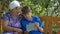 Grandson showing grandmother how to use tablet