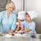 Grandsons help grandma to bake at Christmas