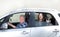 Granfather, grandchild and dog in car