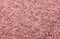 Granite background close up. Bright hard pink granite rock texture for template or mock up.