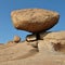 Granite boulder balancing on a edge