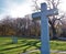 A granite cross in a military cemetery