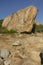 Granite, glacial boulder on gravel moraine at Hammonasset Beach,