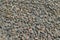 granite gravel reinforcement of road embankment covered wth steel mesh - full-frame background