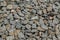 granite gravel reinforcement of road embankment covered wth steel mesh - full-frame background