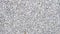 Granite gravel texture. Road surface made with small gravel. Textured gray pebbles. Crushed material background