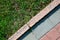 Granite Pavement and Grass Texture