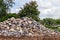 Granite piles on the ground near trees