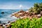 Granite rocky coastline on tropical La Digue island, Seychelles. Beautiful palm trees, boulders and pacific ocean