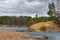 Granite sandy cape and frozen pond. Chelyabinsk, Blue Quarry