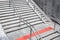 Granite staircase with stone steps and stainless steel iron handrail descent to the underground crossing.