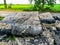Granite stone rock slabs of a demolished road in a nature landscape