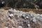 granite stones, sand and earth, dug during the extraction of peat on-site preparation for construction of the road