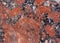Granite texture. Reddish-brown base with black and gray spots. Used as a background.