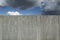 Granite wall with cloudscape and a blue sky