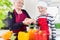 Granny cooking together with her grandson