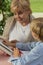 Granny and grandchild reading book