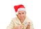 Granny in red Santa Claus hat and clock