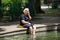 Granny sitting with legs in spa health green water