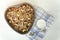 Granola on a baking sheet and yogurt on a light white background