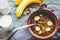 Granola with bananas, nuts, figs and honey, milk, healthy breakf