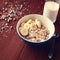 Granola bowl with banana, raisins and nuts closeup